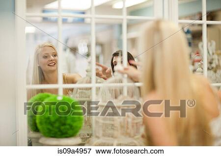 Women shopping together in store View Large Photo Image Stock Photo - Women shopping together in store. Fotosearch