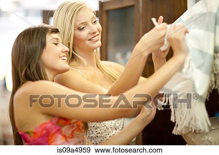 Women shopping together in store View Large Photo Image Stock Photo - Women shopping together in store. Fotosearch