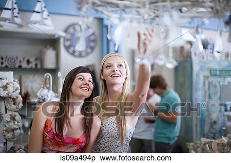 Women shopping together in store View Large Photo Image Stock Photography - Women shopping together in store. Fotosearch