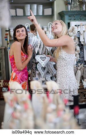 Women shopping together in store View Large Photo Image Stock Photography - Women shopping together in store. Fotosearch