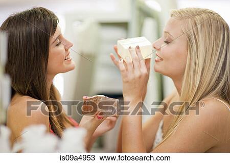 Women smelling candles in store View Large Photo Image Stock Image - Women smelling candles in store. Fotosearch