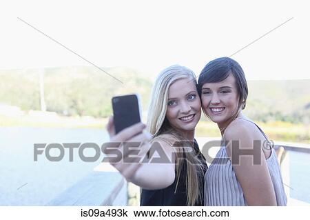 Women taking picture of themselves View Large Photo Image Stock Image - Women taking picture of themselves. Fotosearch
