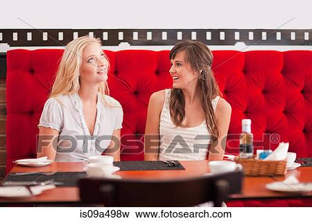 Women talking in cafe View Large Photo Image Stock Photo - Women talking in cafe. Fotosearch