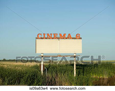 Abandoned drive-in movie sign in field View Large Photo Image Picture - Abandoned drive-in movie sign in field. Fotosearch