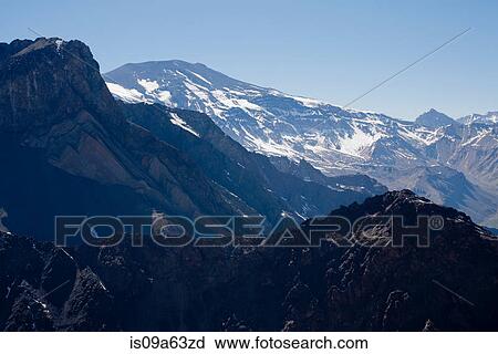 Stock Image - Aerial view of snowy mountains. Fotosearch