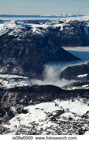 Stock Image - Aerial view of snowy mountains. Fotosearch