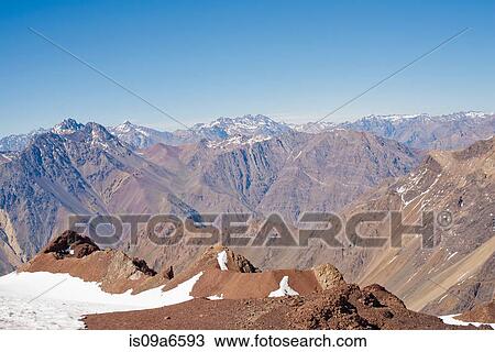 Stock Image - Aerial view of snowy mountains. Fotosearch