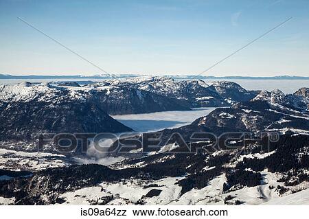 Stock Photo - Aerial view of snowy mountains. Fotosearch