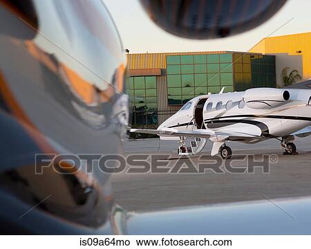 Picture - Airplane with open door on runway. Fotosearch