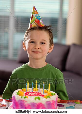 Boy smiling with birthday cake View Large Photo Image Picture - Boy smiling with birthday cake. Fotosearch