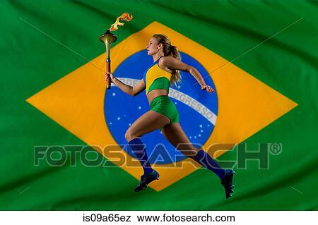 Stock Photo - Brazilian runner carrying Olympic torch. Fotosearch