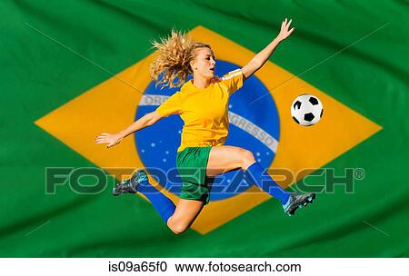 Stock Image - Brazilian soccer player by flag. Fotosearch