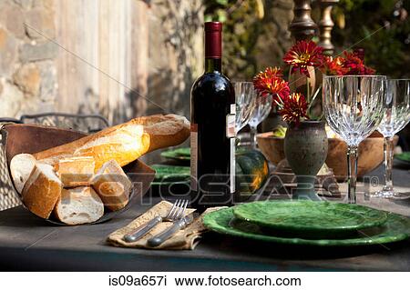 Bread and wine at set table View Large Photo Image Stock Image - Bread and wine at set table. Fotosearch