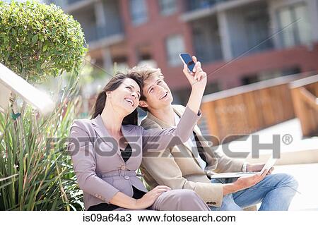 Busies people taking picture together View Large Photo Image Stock Image - Busies people taking picture together. Fotosearch