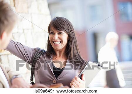 Business people greeting outdoors View Large Photo Image Stock Photography - Business people greeting outdoors. Fotosearch