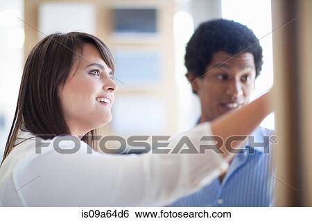 Stock Photograph - Business people talking in office. Fotosearch