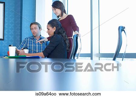 Business people working at desk View Large Photo Image Picture - Business people working at desk. Fotosearch