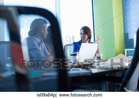 Business people working at desk View Large Photo Image Stock Image - Business people working at desk. Fotosearch