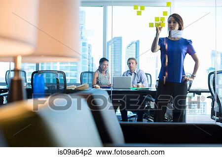 Stock Image - Business people working in office. Fotosearch