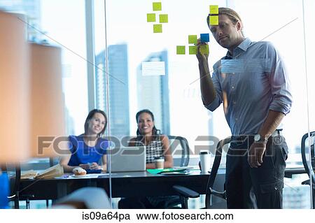 Stock Image - Business people working in office. Fotosearch