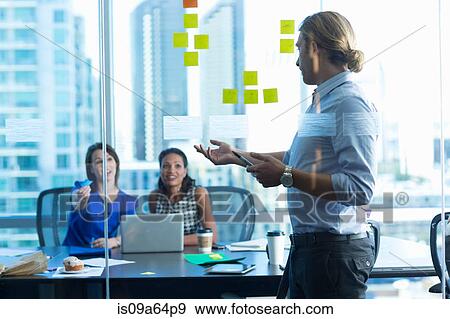 Stock Photo - Business people working in office. Fotosearch
