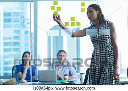 Stock Photography - Business people working in office. Fotosearch