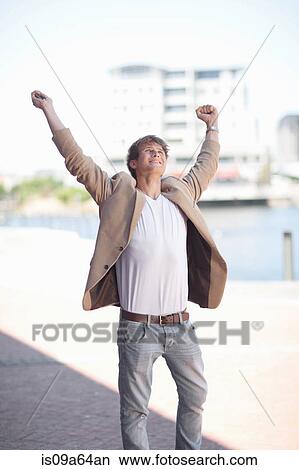 Businessman cheering outdoors View Large Photo Image Picture - Businessman cheering outdoors. Fotosearch