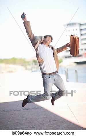 Businessman jumping for joy View Large Photo Image Picture - Businessman jumping for joy. Fotosearch