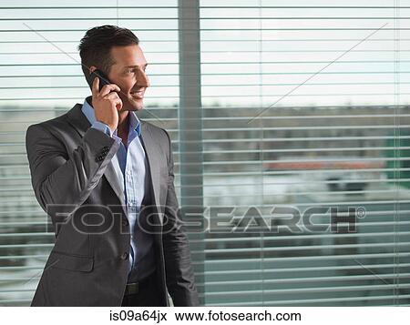 Businessman talking on cell phone View Large Photo Image Stock Photo - Businessman talking on cell phone. Fotosearch