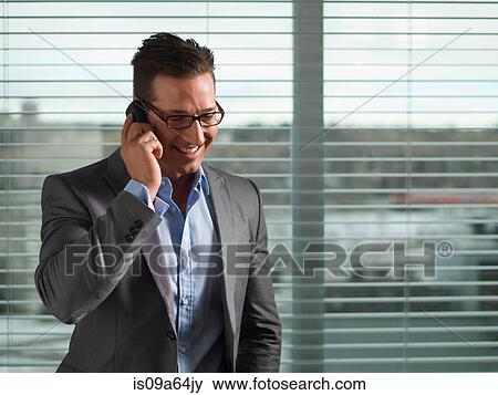 Businessman talking on cell phone View Large Photo Image Stock Photo - Businessman talking on cell phone. Fotosearch