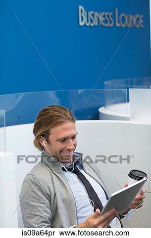 Stock Photography - Businessman using tablet computer. Fotosearch