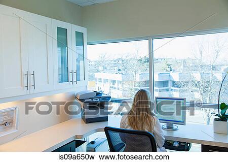 Businesswoman working at computer View Large Photo Image Stock Photo - Businesswoman working at computer. Fotosearch