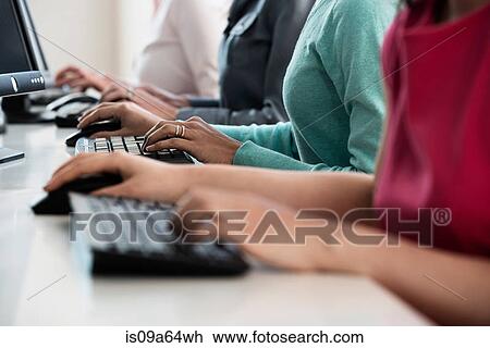 Businesswomen working at computers View Large Photo Image Stock Image - Businesswomen working at computers. Fotosearch