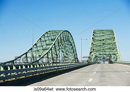 Cars driving on bridge View Large Photo Image Stock Photograph - Cars driving on bridge. Fotosearch