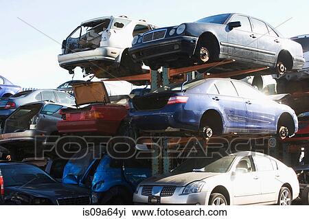 Stock Image - Cars sitting in junkyard. Fotosearch
