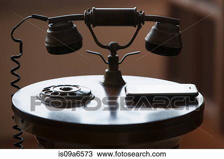 Cell phone by antique phone View Large Photo Image Stock Image - Cell phone by antique phone. Fotosearch