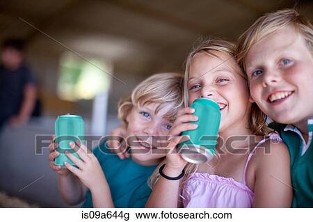 Children drinking soda in garage View Large Photo Image Stock Image - Children drinking soda in garage. Fotosearch