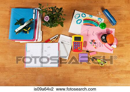 Stock Image - Child's notebooks, pens and toys. Fotosearch