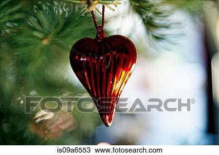 Stock Image - Christmas ornament on tree. Fotosearch