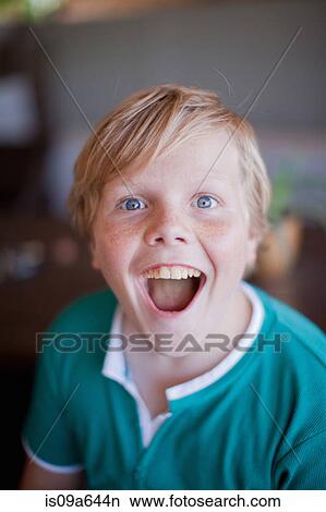 Picture - Close up of boy's smiling face. Fotosearch