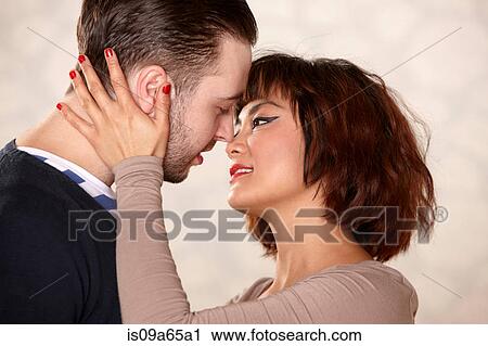 Close up of couple hugging View Large Photo Image Stock Image - Close up of couple hugging. Fotosearch