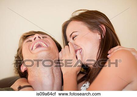 Stock Image - Close up of couple laughing. Fotosearch