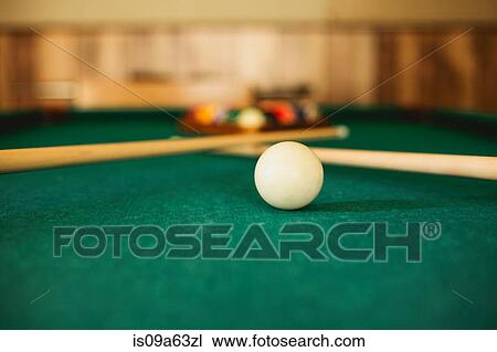 Stock Image - Close up of cue ball on pool table. Fotosearch