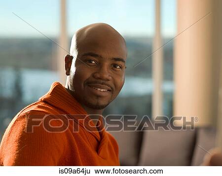 Stock Photograph - Close up of man's smiling face. Fotosearch