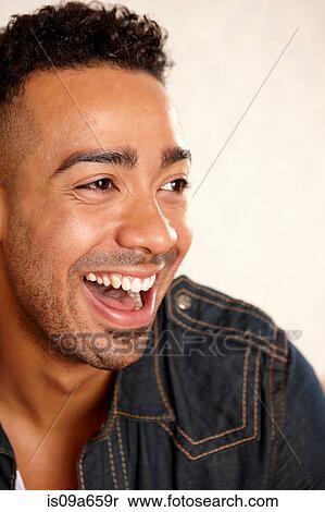 Stock Photography - Close up of man's smiling face. Fotosearch