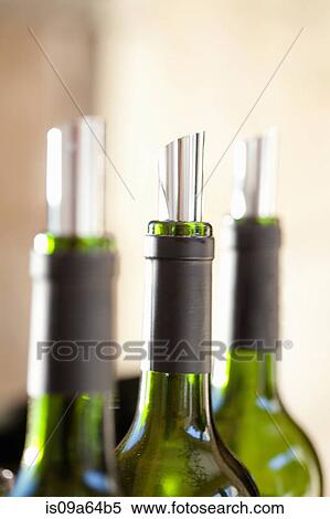 Close up of metal corks in wine bottles View Large Photo Image Stock Photography - Close up of metal corks in wine bottles. Fotosearch