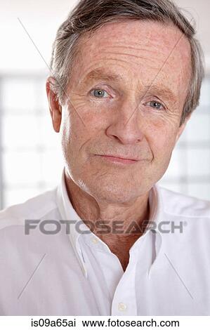 Stock Image - Close up of older man's smiling face. Fotosearch