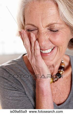 Close up of older woman's smiling face View Large Photo Image Stock Photo - Close up of older woman's smiling face. Fotosearch