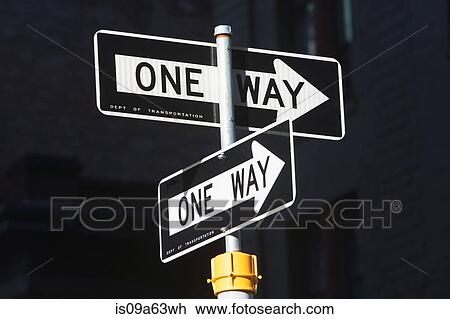 Stock Image - Close up of one way signs on street. Fotosearch