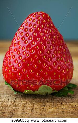 Stock Photography - Close up of strawberry on board. Fotosearch